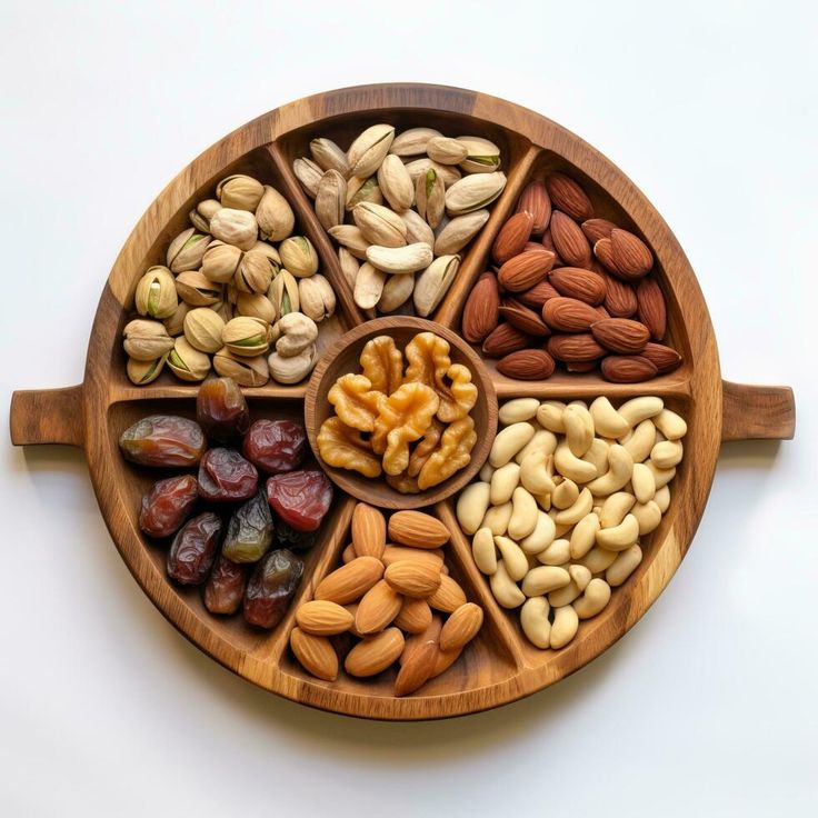 Download Dried fruits nuts in bowls set dry apricots figs raisins walnuts almonds and other healthy nutritious snacks white table for free